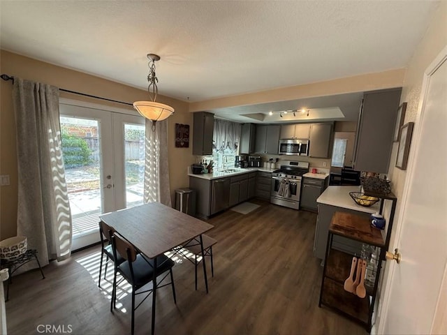 42523 56th St W, Lancaster, CA 93536 - dining area featuring plenty of natural light, dark wood-style flooring, french doors, and a textured ceiling