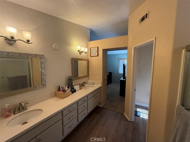 42523 56th St W, Lancaster, CA 93536 - bathroom featuring wood finished floors and double vanity