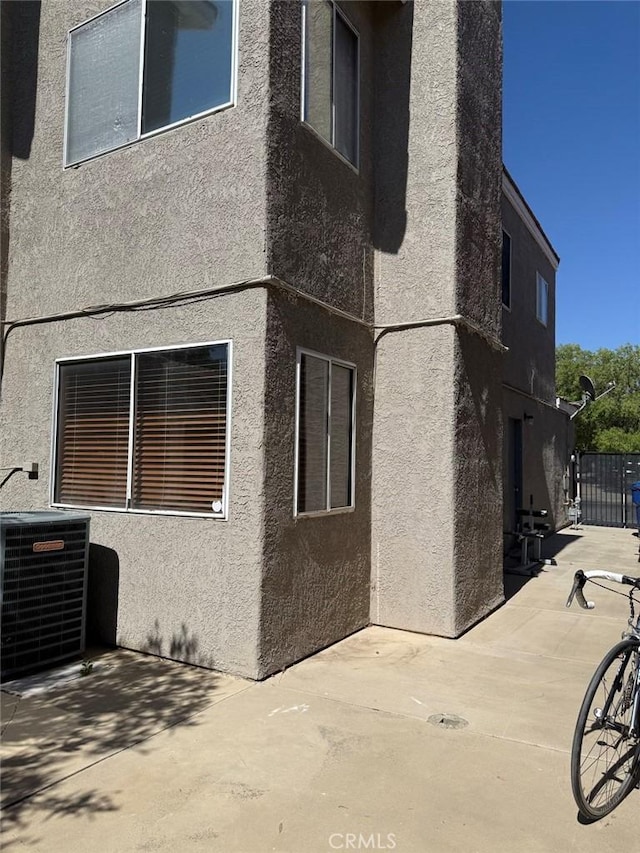 42523 56th St W, Lancaster, CA 93536 - view of property exterior featuring stucco siding and a patio area
