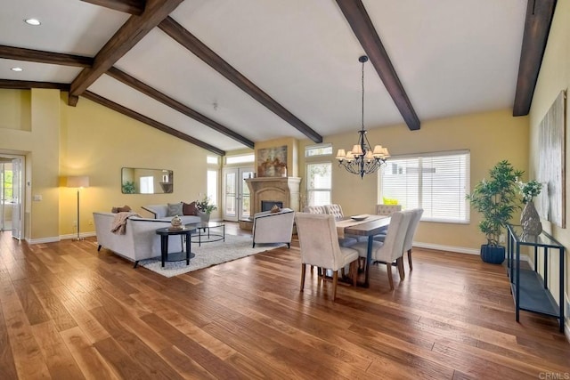 4956 Lamia Way, Oceanside, CA 92056 - dining space featuring wood finished floors, a chandelier, recessed lighting, and a fireplace