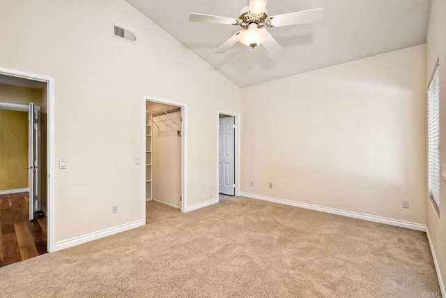 4956 Lamia Way, Oceanside, CA 92056 - unfurnished bedroom featuring carpet flooring, a spacious closet, high vaulted ceiling, a closet, and a ceiling fan