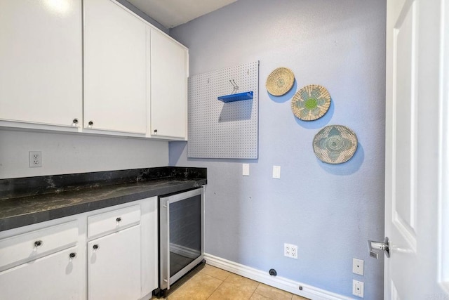 4956 Lamia Way, Oceanside, CA 92056 - kitchen featuring wine cooler, white cabinetry, dark countertops, and light tile patterned flooring