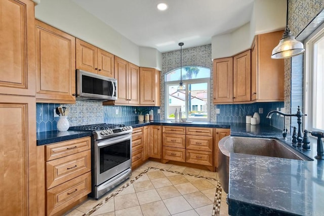 4956 Lamia Way, Oceanside, CA 92056 - kitchen with stainless steel appliances, light tile patterned floors, backsplash, pendant lighting, and recessed lighting