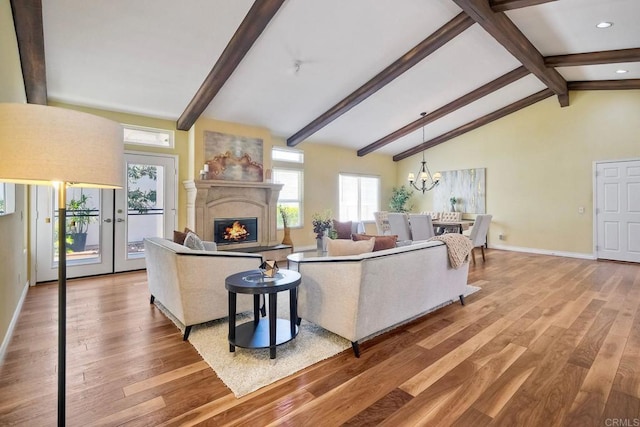 4956 Lamia Way, Oceanside, CA 92056 - living area with wood finished floors, a glass covered fireplace, a chandelier, and recessed lighting
