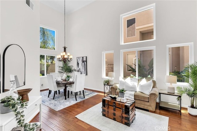 18 Argento, Mission Viejo, CA 92692 - living room with a towering ceiling, a chandelier, and wood finished floors
