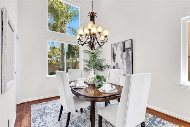 18 Argento, Mission Viejo, CA 92692 - dining room with a chandelier, wood finished floors, and a high ceiling