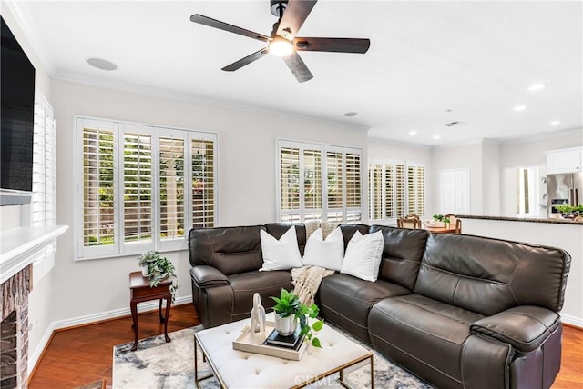 18 Argento, Mission Viejo, CA 92692 - living room with a fireplace, ceiling fan, wood finished floors, ornamental molding, and plenty of natural light