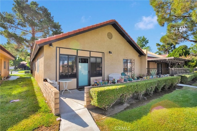 11714 Oak St, Apple Valley, CA 92308 - rear view of house featuring stucco siding and a lawn