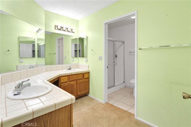 11714 Oak St, Apple Valley, CA 92308 - full bath featuring vanity, a stall shower, tile patterned flooring, and a textured ceiling