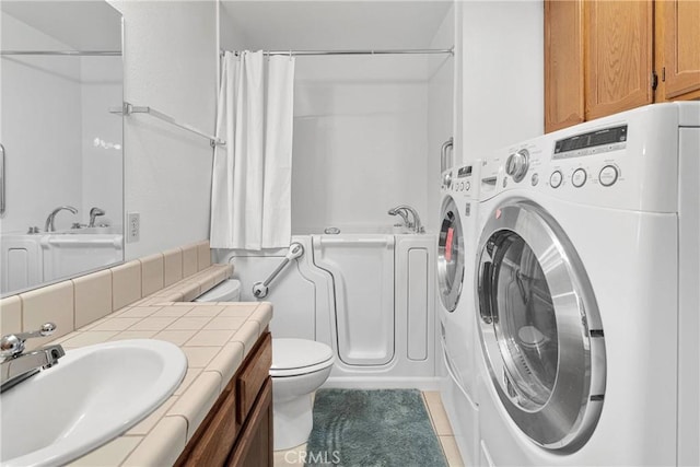 11714 Oak St, Apple Valley, CA 92308 - bathroom with shower / bath combo with shower curtain, tile patterned flooring, vanity, and washing machine and clothes dryer