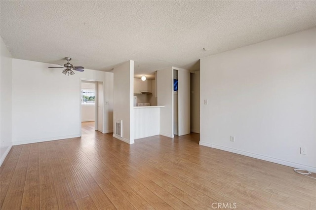 820 N Raymond Ave, Pasadena, CA 91103 - unfurnished living room with light wood-style floors, a textured ceiling, and a ceiling fan