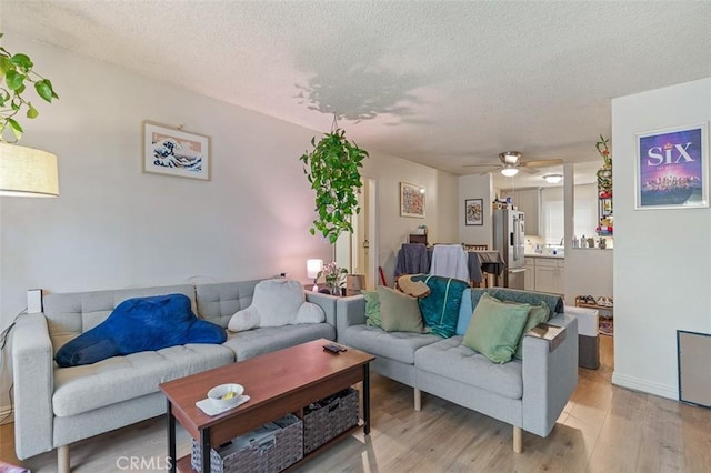 820 N Raymond Ave, Pasadena, CA 91103 - living area with a textured ceiling, light wood-style floors, and ceiling fan