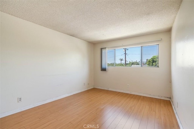 820 N Raymond Ave, Pasadena, CA 91103 - empty room featuring light wood finished floors and a textured ceiling
