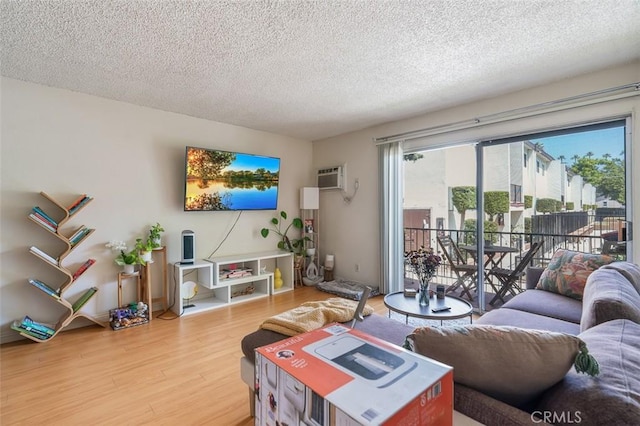 820 N Raymond Ave, Pasadena, CA 91103 - living area with a textured ceiling, wood finished floors, and a wall unit AC