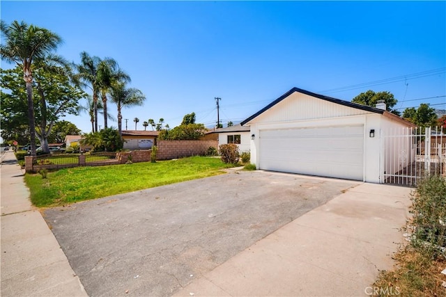 1019 E Armstead St, Azusa, CA 91702 - view of front of property featuring driveway and an attached garage