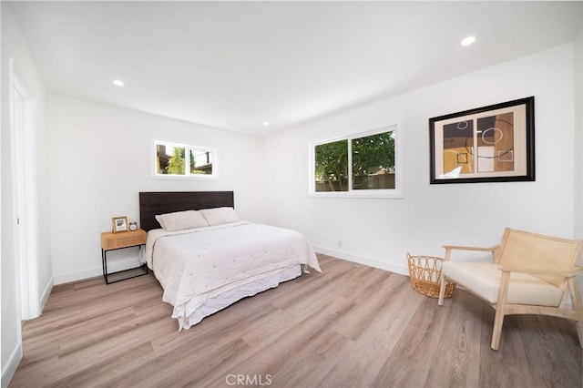 1019 E Armstead St, Azusa, CA 91702 - bedroom with light wood-type flooring, multiple windows, and recessed lighting