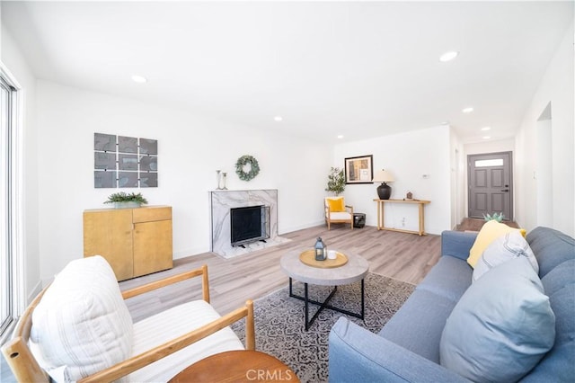 1019 E Armstead St, Azusa, CA 91702 - living area featuring wood finished floors, a high end fireplace, and recessed lighting