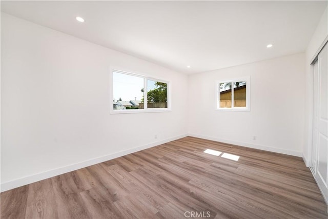 1019 E Armstead St, Azusa, CA 91702 - unfurnished bedroom featuring wood finished floors, recessed lighting, and a closet