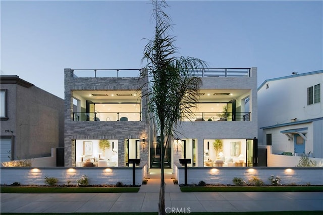 1313 Ocean Ave, Seal Beach, CA 90740 - view of front of property with a balcony and stone siding