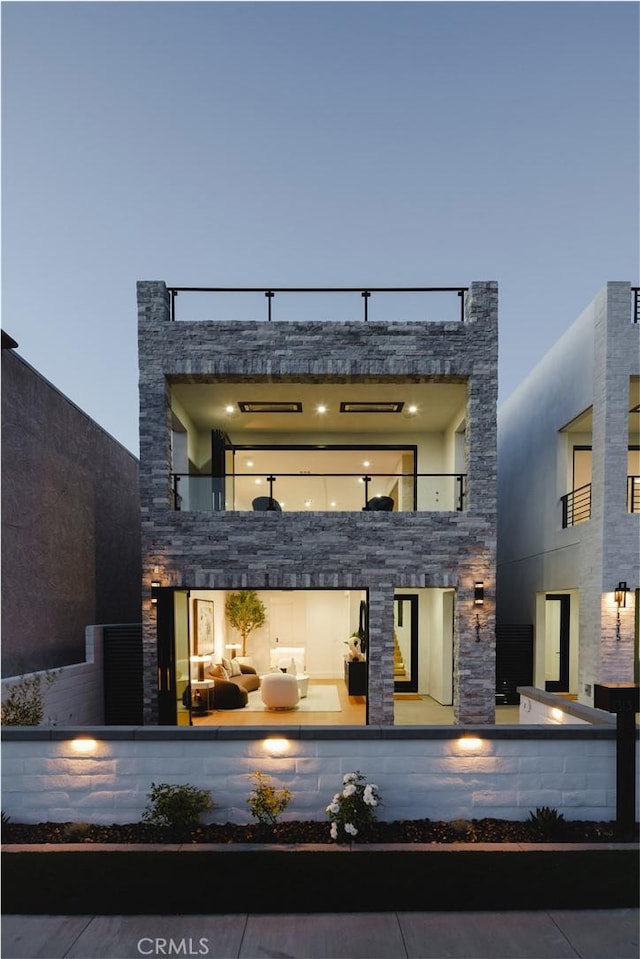 1313 Ocean Ave, Seal Beach, CA 90740 - rear view of house with stone siding and a balcony