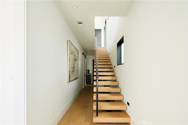 1313 Ocean Ave, Seal Beach, CA 90740 - stairway with wood finished floors and recessed lighting