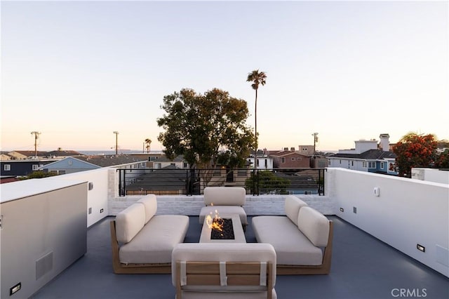 1315 Ocean Ave, Seal Beach, CA 90740 - patio terrace at dusk featuring an outdoor living space with a fire pit