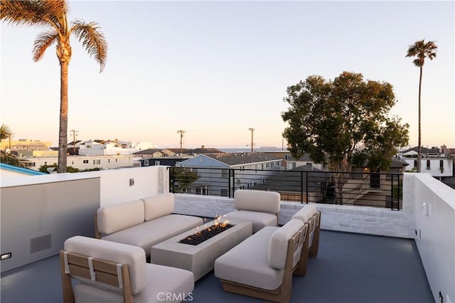 1315 Ocean Ave, Seal Beach, CA 90740 - patio terrace at dusk with an outdoor living space with a fire pit