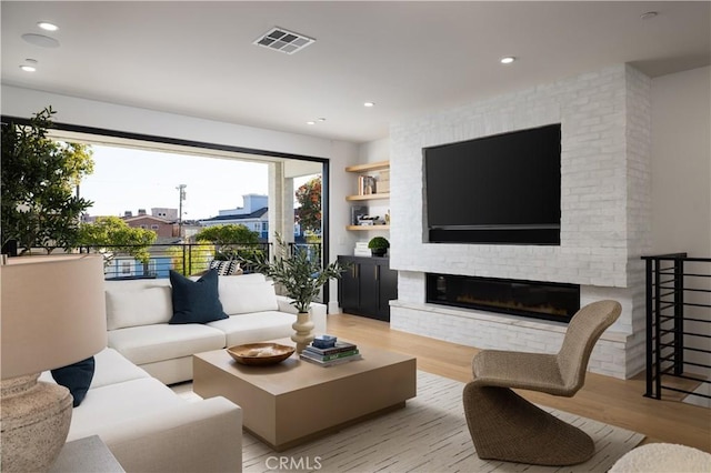 1315 Ocean Ave, Seal Beach, CA 90740 - living room with light wood-style flooring, a brick fireplace, and recessed lighting
