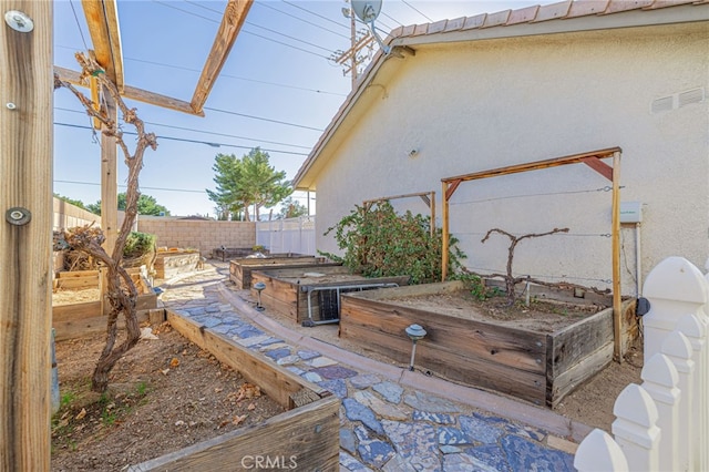 2534 Desert Rose Dr, Lancaster, CA 93536 - view of patio / terrace featuring a garden