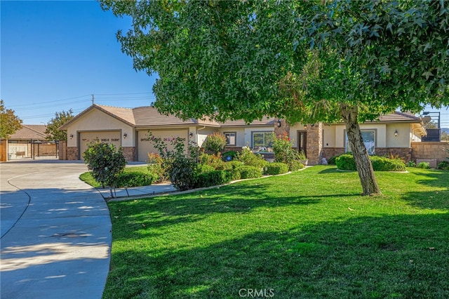 2534 Desert Rose Dr, Lancaster, CA 93536 - view of front facade with stucco siding, concrete driveway, stone siding, and an attached garage