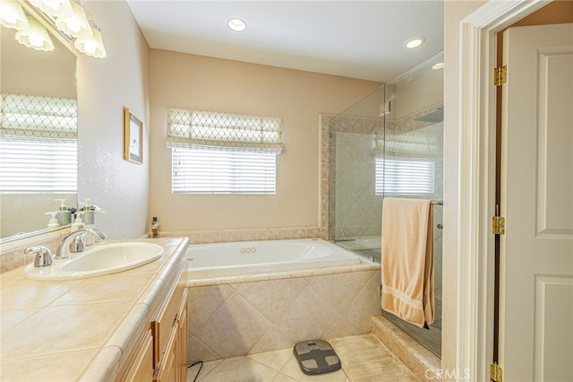 2534 Desert Rose Dr, Lancaster, CA 93536 - bathroom with a garden tub, vanity, a shower stall, tile patterned flooring, and recessed lighting