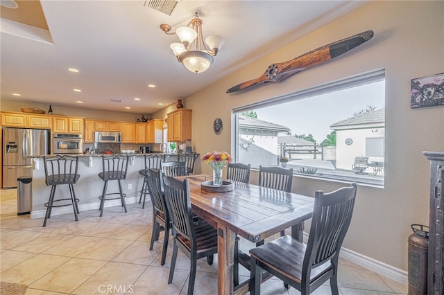 2534 Desert Rose Dr, Lancaster, CA 93536 - dining room with light tile patterned flooring, recessed lighting, and a chandelier
