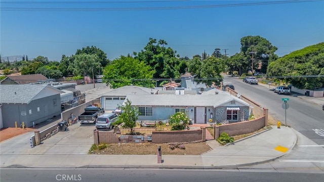 9964 Cedar Ave, Bloomington, CA 92316 - view of front of house with a fenced front yard and concrete driveway