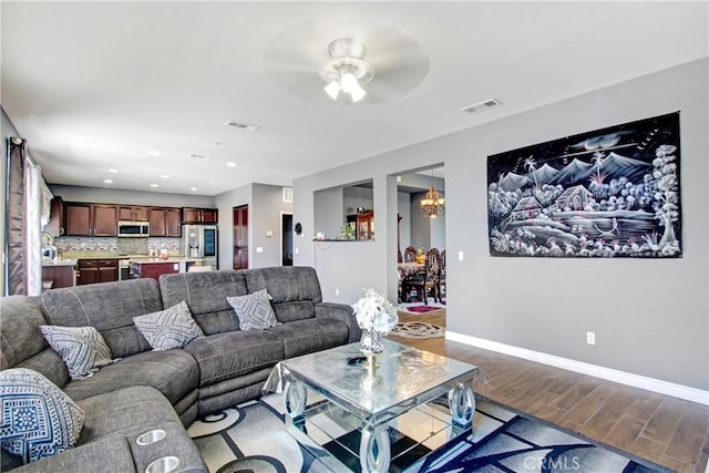 26810 Sugarite Canyon Dr, Moreno Valley, CA 92555 - living room featuring wood finished floors, ceiling fan, a chandelier, and recessed lighting