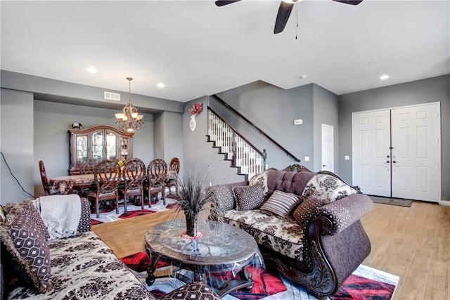 26810 Sugarite Canyon Dr, Moreno Valley, CA 92555 - living room featuring a chandelier, stairs, ceiling fan, recessed lighting, and light wood-type flooring