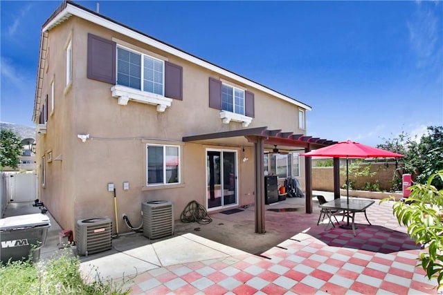 26810 Sugarite Canyon Dr, Moreno Valley, CA 92555 - rear view of house with stucco siding, a patio, and ceiling fan