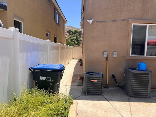 26810 Sugarite Canyon Dr, Moreno Valley, CA 92555 - view of side of property featuring stucco siding and a patio