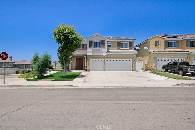 26810 Sugarite Canyon Dr, Moreno Valley, CA 92555 - traditional-style house with a garage, concrete driveway, and stucco siding