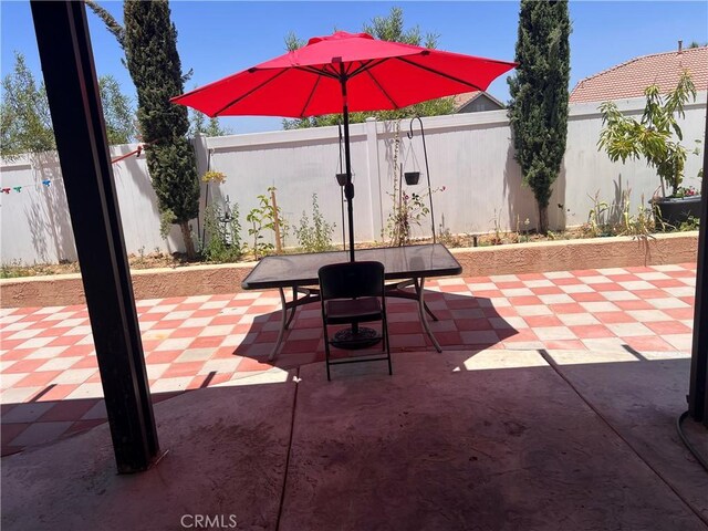 26810 Sugarite Canyon Dr, Moreno Valley, CA 92555 - fenced backyard featuring a patio area and outdoor dining area