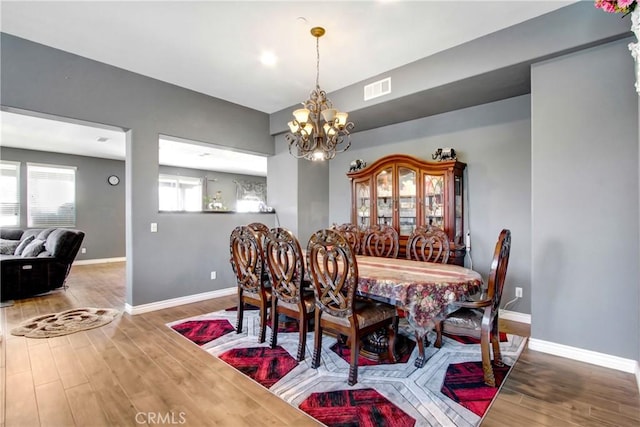 26810 Sugarite Canyon Dr, Moreno Valley, CA 92555 - dining room with a chandelier and wood finished floors