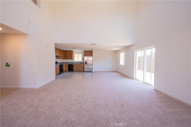 363 Arpent Ct, Merced, CA 95341 - unfurnished living room with a high ceiling and light carpet