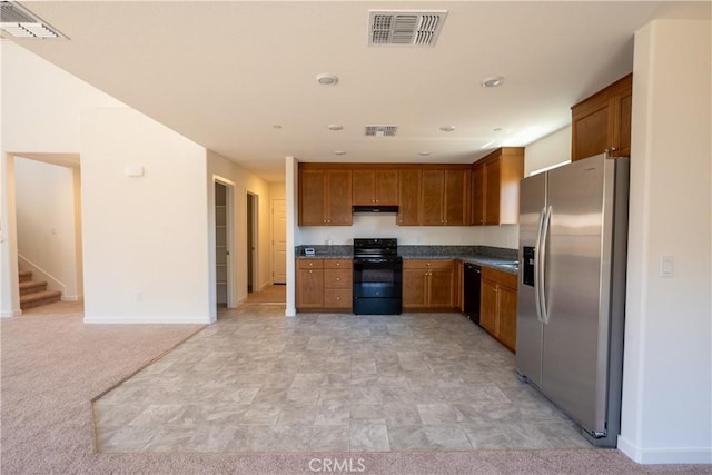 363 Arpent Ct, Merced, CA 95341 - kitchen featuring black appliances, under cabinet range hood, dark countertops, and brown cabinets
