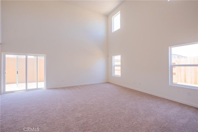 363 Arpent Ct, Merced, CA 95341 - empty room featuring a high ceiling and carpet floors
