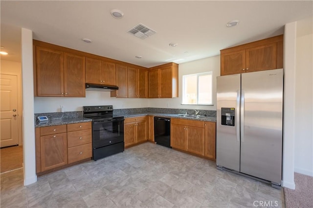 363 Arpent Ct, Merced, CA 95341 - kitchen featuring black appliances, under cabinet range hood, brown cabinets, dark stone counters, and recessed lighting