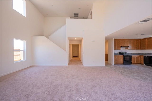 363 Arpent Ct, Merced, CA 95341 - unfurnished living room featuring a high ceiling and light carpet