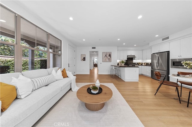 186 Bishop Lndg, Irvine, CA 92620 - living room featuring recessed lighting and light wood-style flooring