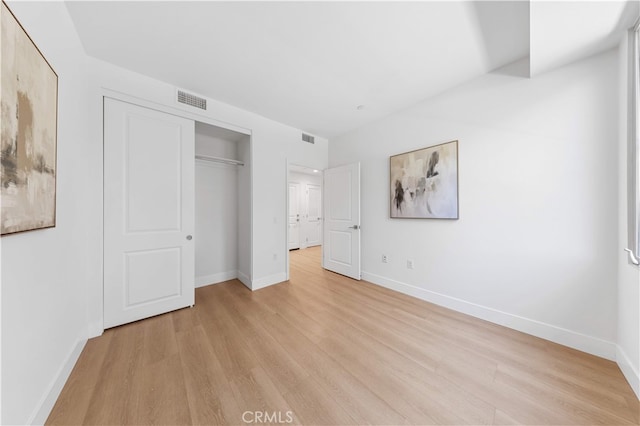 186 Bishop Lndg, Irvine, CA 92620 - unfurnished bedroom featuring light wood finished floors and a closet