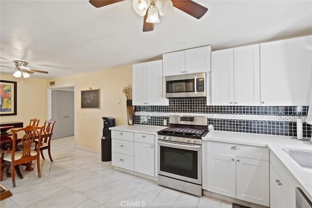 1094 Manzanita Ave, Chico, CA 95926 - kitchen featuring stainless steel appliances, a ceiling fan, and backsplash