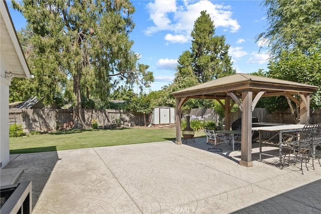 1094 Manzanita Ave, Chico, CA 95926 - fenced backyard featuring a gazebo, a storage shed, a patio area, and outdoor dining area