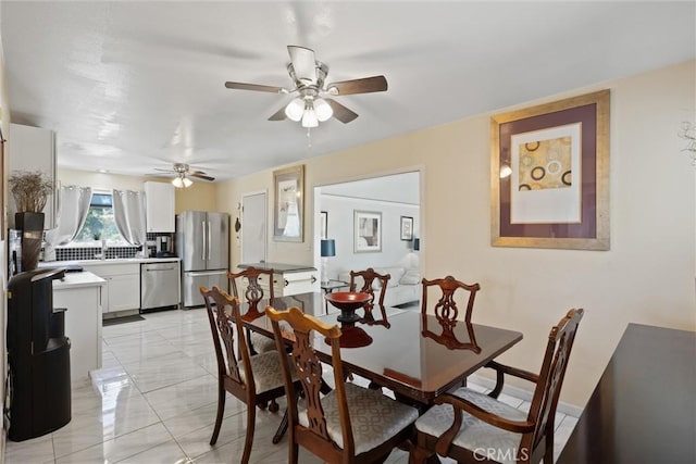 1094 Manzanita Ave, Chico, CA 95926 - dining area with ceiling fan and light marble finish flooring